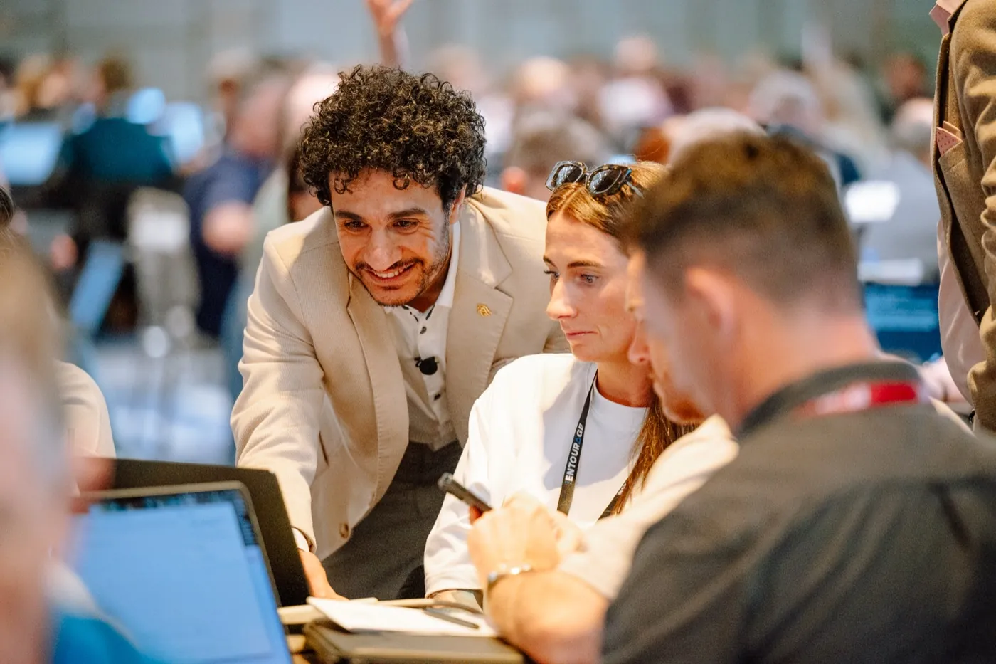 Abdo helping participants at their laptop