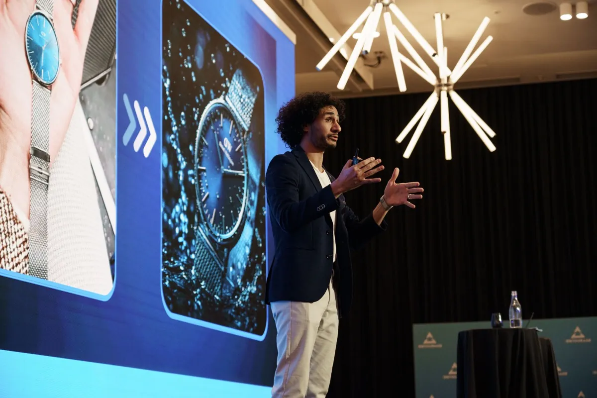Abdo Samy delivering a keynote on stage at the AI Intensive